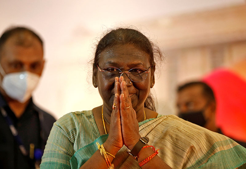 Droupadi Murmu, 64, a female politician who was nominated as presidential candidate by Prime Minister Narendra Modi's ruling Bharatiya Janata Party (BJP), greets an audience as she arrives to attend a meeting ahead of India's presidential elections, in Ahmedabad, India, July 17, 2022. REUTERS/Amit Dave