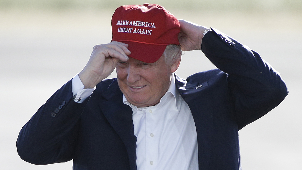 FILE - In this June 1, 2016, file photo, Republican presidential candidate Donald Trump wears his "Make America Great Again" hat at a rally in Sacramento, Calif. Trump’s “Make America Great Again” hats proudly tout they are “Made in USA.” Not necessarily always the case, an Associated Press review found. (AP Photo/Jae C. Hong, File)