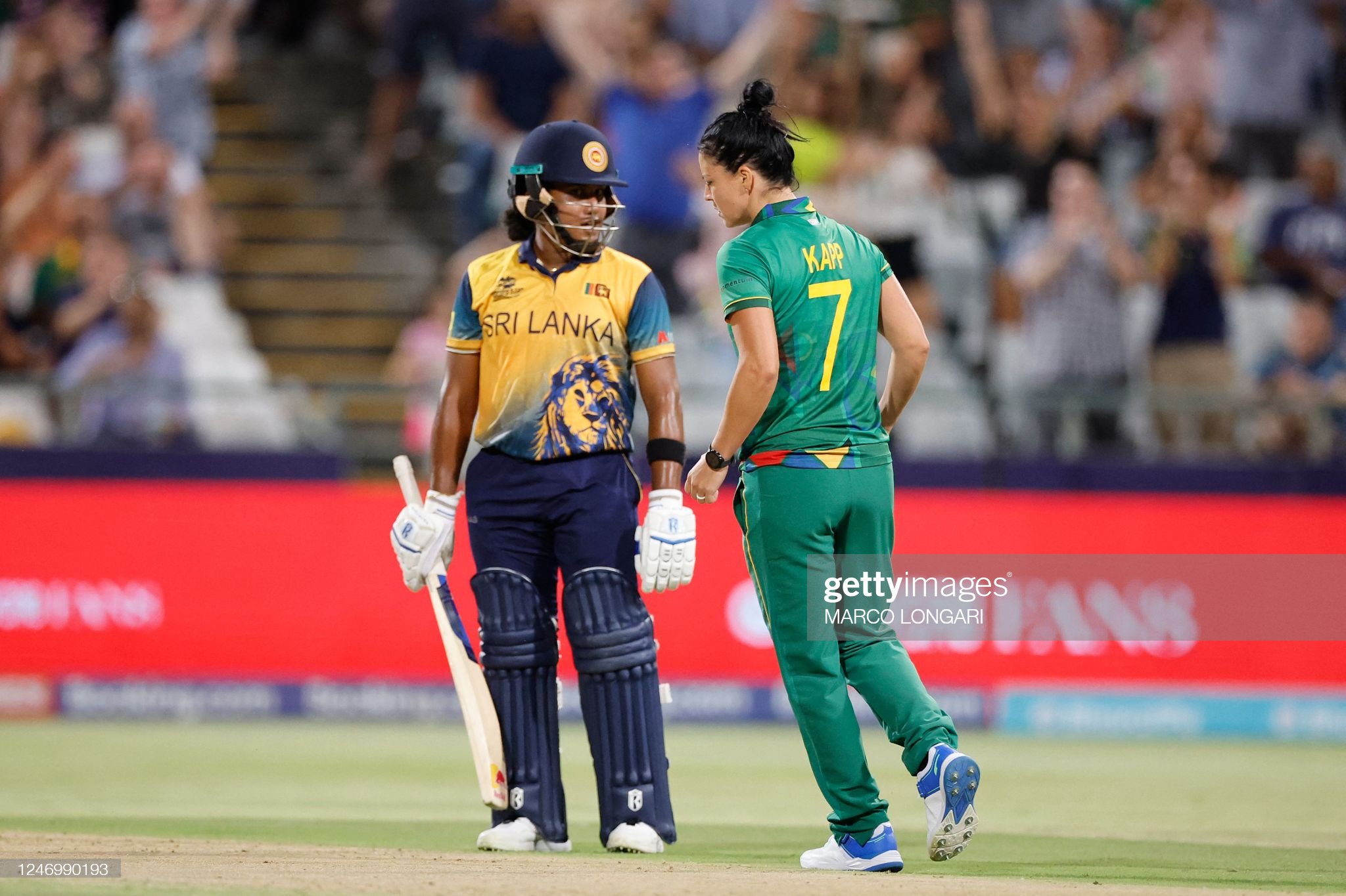 South Africa's Marizanne Kapp (R) celebrates after the dismissal of Sri Lanka's Chamari Athapaththu (L) during the Group A T20 women's World Cup cricket match between South Africa and Sri Lanka at Newlands Stadium in Cape Town on February 10, 2023. (Photo by Marco Longari / AFP) (Photo by MARCO LONGARI/AFP via Getty Images)