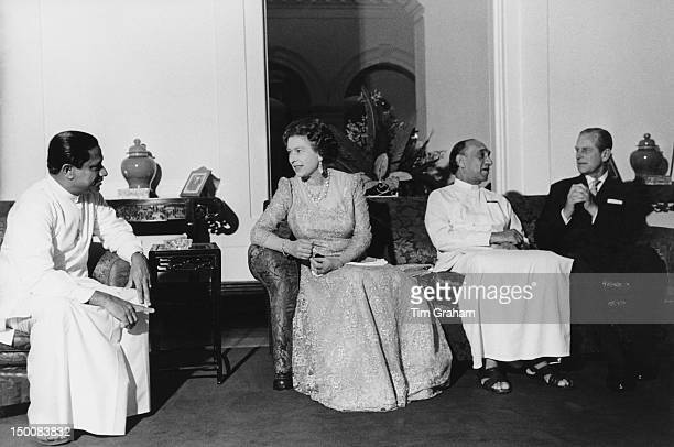 Queen Elizabeth II and the Duke of Edinburgh with Sri Lankan President Junius Richard Jayewardene (1906 - 1996, second from right) in Colombo, during a State Visit to Sri Lanka, 22nd October 1981. The Queen's dress was designed by Sir Hardy Amies. (Photo by Tim Graham Photo Library via Getty Images)