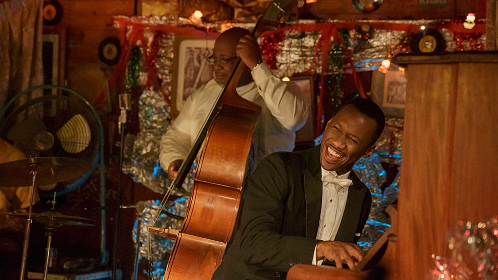 Dr. Donald Shirley (Mahershala Ali, right) gives an impromptu performance in "Green Book," directed by Peter Farrelly.